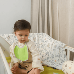 Happy Matty Airport Blanket Spread on a Baby Bed