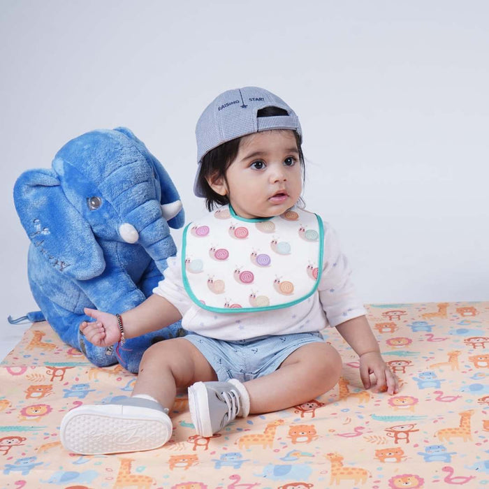 Baby playing on the animal-print waterproof crib sheet