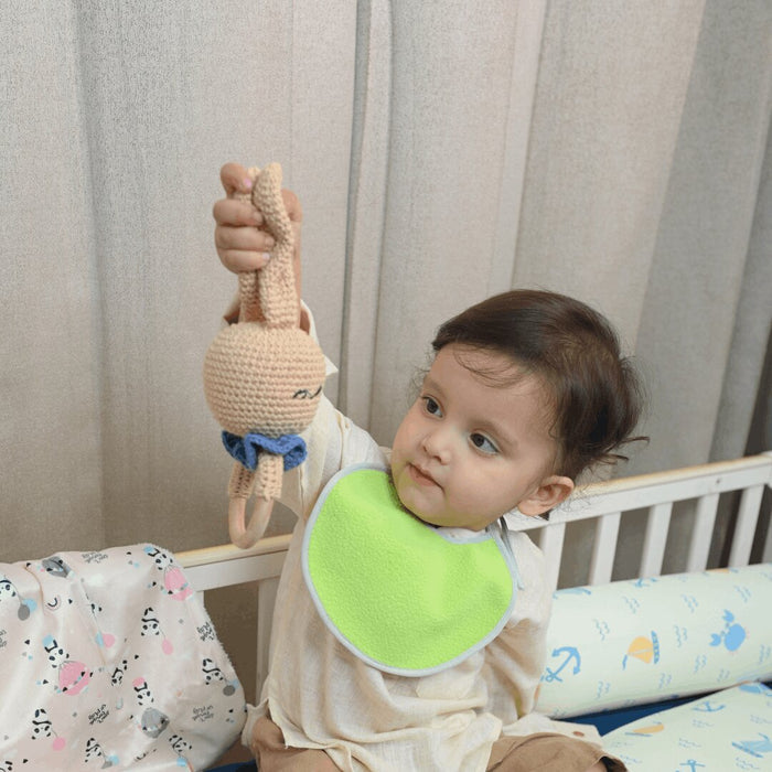 Baby Holding Happy Matty Bunny Crochet Rattle