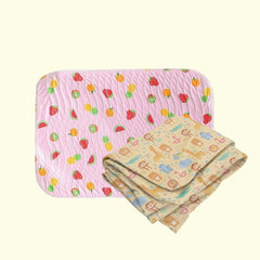 Fruit print baby dry sheet and animal print crib sheet shown together