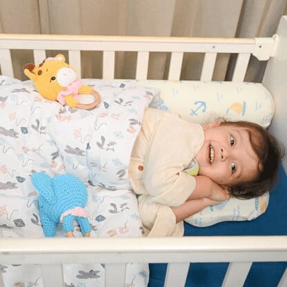Happy Matty Baby Wrapped in Happy Matty Kites Quilt