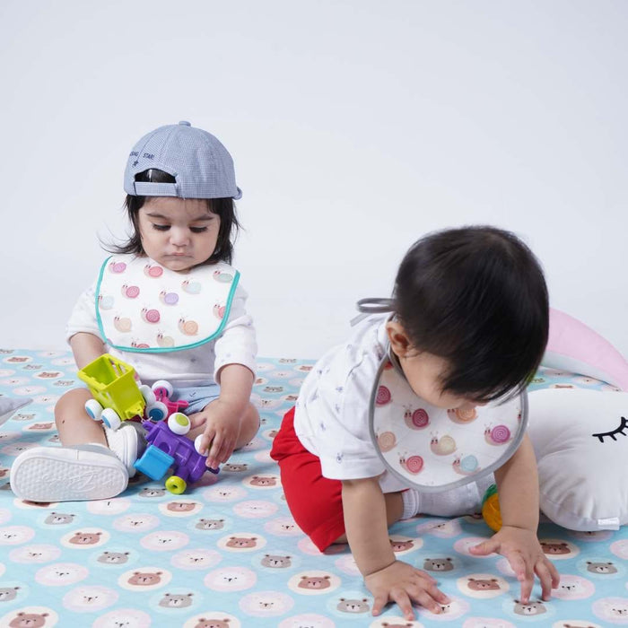 Baby Playing on Teddy Print Crib Sheet